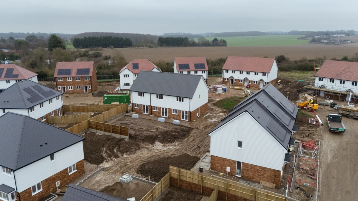 Image shows houses in construction phase in rural location