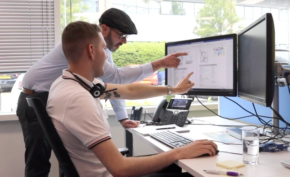 Moat colleagues working together at computer