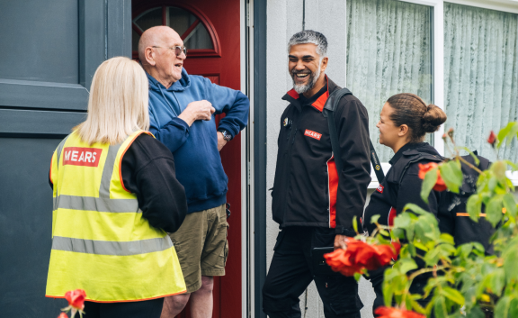 Mears operatives chatting with customer on doorstep