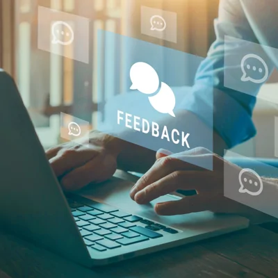 Person at laptop with feedback graphic